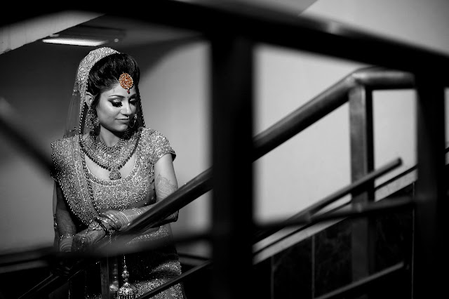 Black and white portrait of a bride on a staircase